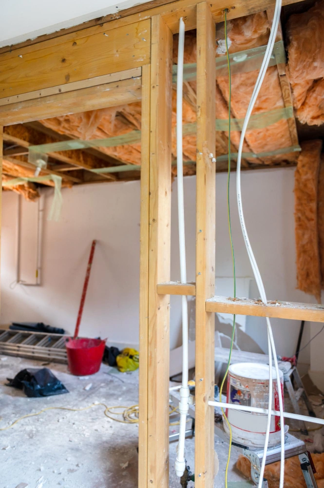 worker inspecting steel reinforcement on a foundation construction site in Los Angeles